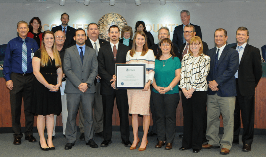 Board of County Commissioners presenting a FEMA CRS plaque to the contributing staff members.